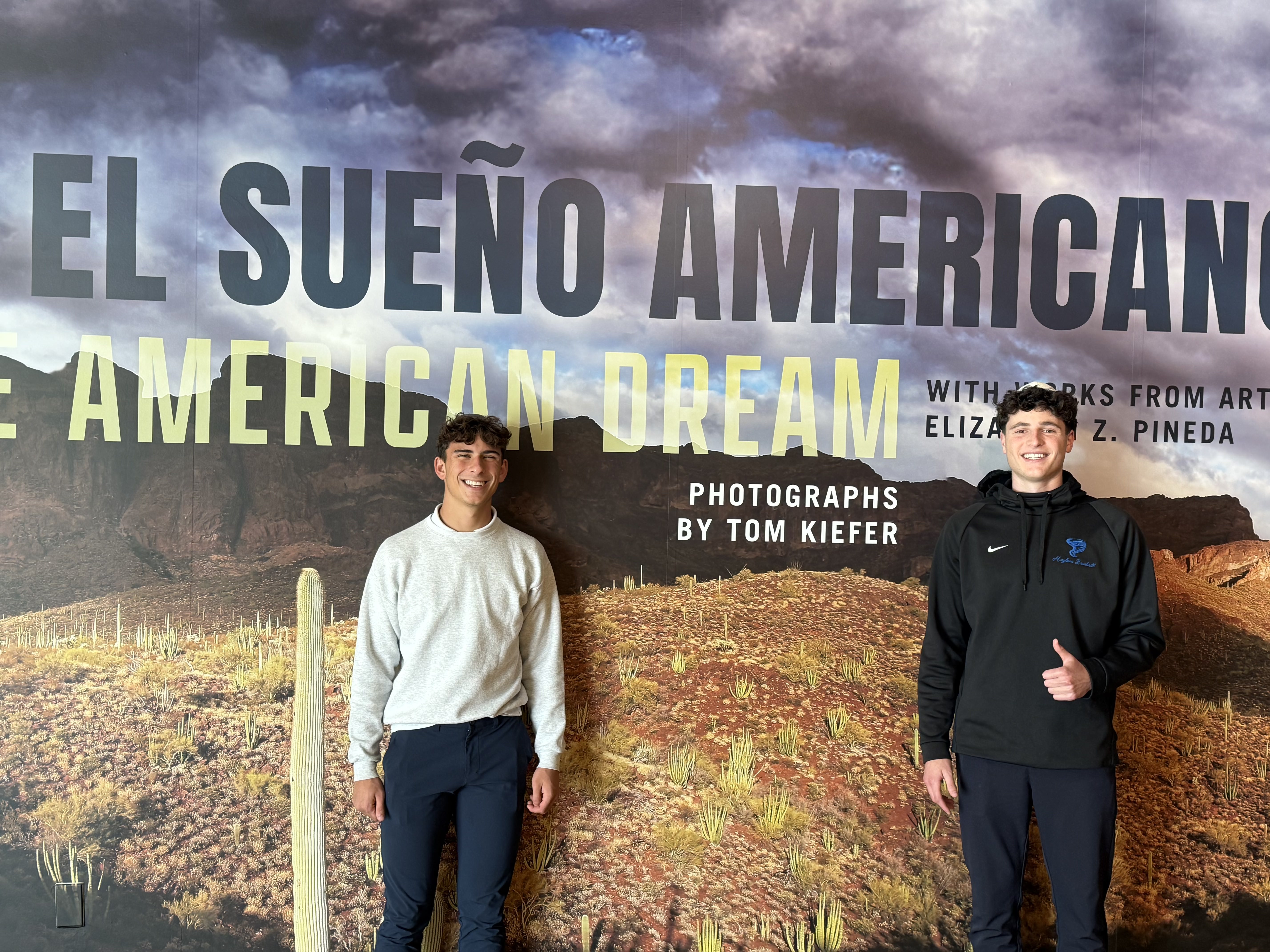 Students visiting the El Sueño Americano exhibit at the Maltz Museum
